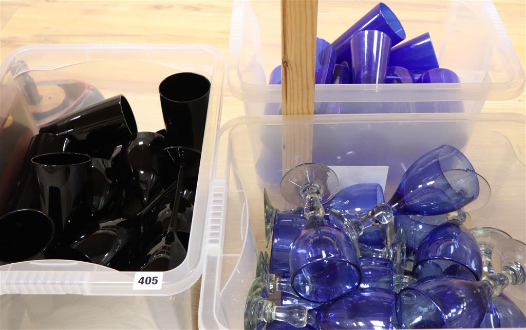 A collection of black, clear blue and crystal blue drinking glasses